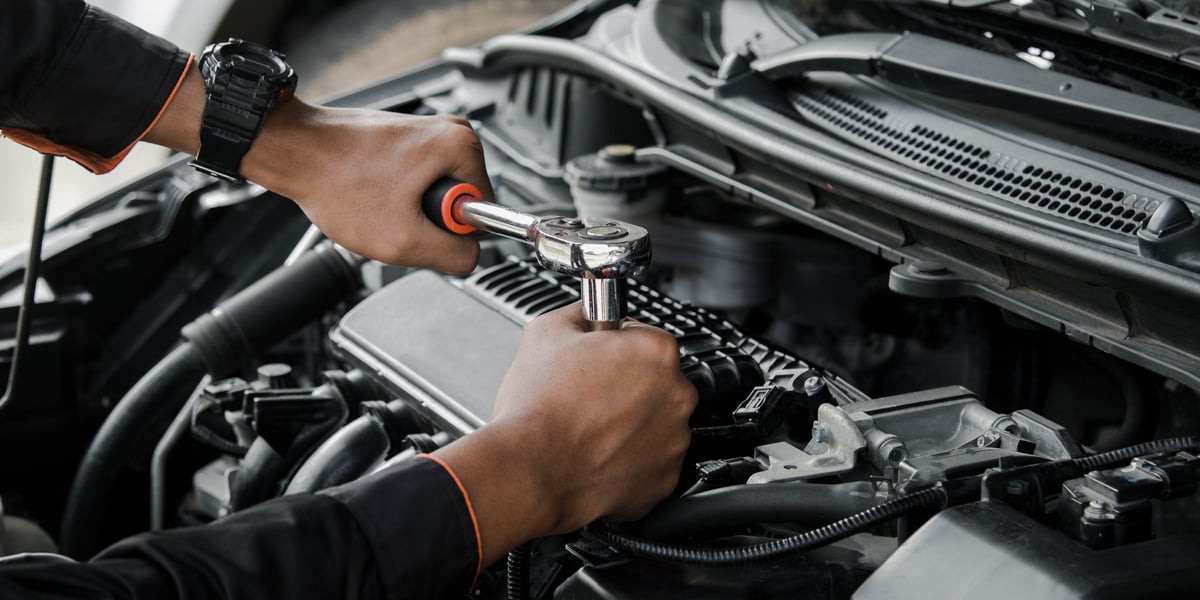 Mechanic repairing a car in a professional automotive shop