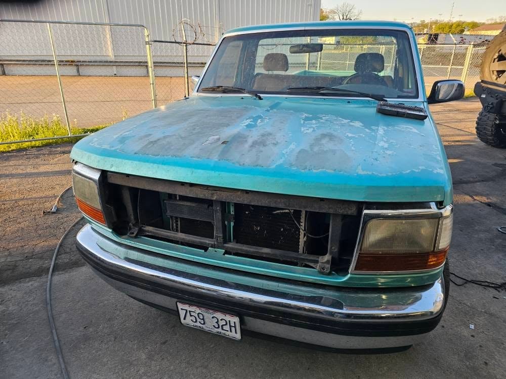 Pickup with a crumpled front end in the shop before body work
